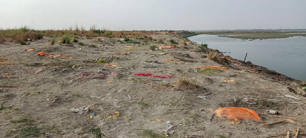 Bodies-buried-in-the-sand-on-the-banks-of-Ganga-river-as-coronavirus-cases-surge-in-Unnao-district-Thursday-May-13-2021-Photo-PTI